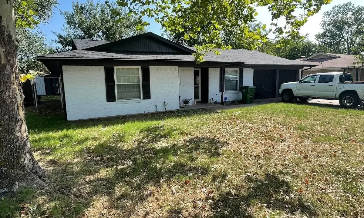 Professional roofing crew working on a residential roof in Metropolis